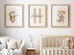 a baby's room with three framed pictures on the wall