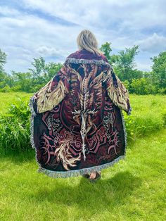 Introducing my latest creation! Upcycled two of the same tapestry blankets featuring artwork by Ruth Thompson to create this empowering, cozy, oversized dragon coat. Features two front pockets and toggle closure for added functionality. Perfect for breezy seaside mornings, late nights at festivals, movie dates, or lounging around the house. Sure to turn heads wherever you may wander! Measurements: Length is 57" Chest is 53" Shoulder to wrist is 25" Unisex design. Model is 5'10 for reference. 100% cotton. Very durable. Machine wash, tumble dry low. This statement jacket was made with all of my heart, for any human, anywhere, that may be attracted to its vibe! My intention is that the piece will amplify the divine nature of your inner being. ✨🌙 Dark Ages Clothing, Ruth Thompson, Tapestry Coat, Aged Clothing, Tapestry Blanket, Blanket Coat, Wardrobe Wishlist, Statement Jacket, Divine Nature