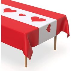 a red and white table with hearts on it