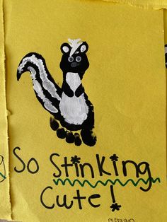 a yellow piece of paper with an image of a skunker on it