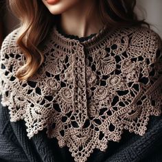 a woman wearing a brown crochet shawl with black sleeves and dark sweater