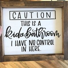 this is a sign that says caution, this is a kid's bathroom i have no control in here