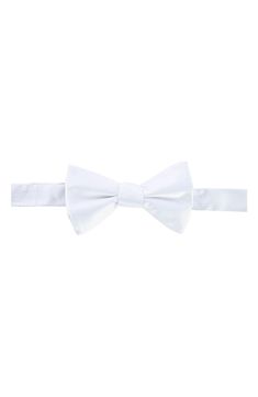 A solid hue ensures this silk bow tie will be a staple for years to come. 100% silk Dry clean Imported Classic White Bow For Formal Occasions, Classic White Tie With Bow Tie Back, Classic White Bow Tie With Detachable Bow, Classic White Bow Tie For Formal Occasions, Formal White Bow Tie With Detachable Bow, White Classic Bow Tie, Classic White Standard Tie Bow, Classic White Suit And Tie Accessories With Satin Bow, Classic White Bow For Black Tie Occasions