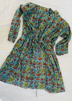 Cotton Knee-length Shirt Dress For Vacation, Knee-length Cotton Shirt Dress For Vacation, Multicolor Cotton Dress With Relaxed Fit, Multicolor Relaxed Fit Cotton Dress, Cotton Long Sleeve Midi Dress For Vacation, Long Sleeve Cotton Midi Dress For Vacation, Beach Cotton Midi Dress With Pattern, Relaxed Fit Cotton Floral Print Dress, Bohemian Long Sleeve Cotton Shirt Dress