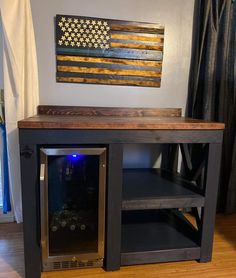 an american flag is mounted on the wall above a wine cooler