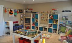 a child's play room with toys and bookshelves