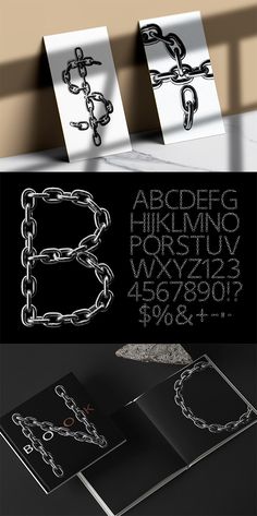 some type of black and white paper with chains on it's sides, including the letter