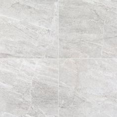 a white marble tile floor with grey grouting