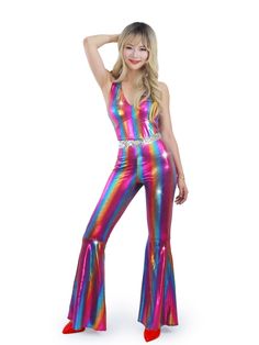 a woman in a rainbow colored jumpsuit posing for the camera