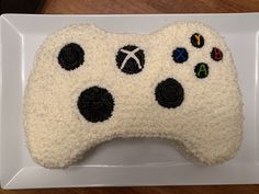 a cake made to look like a video game controller on top of a white plate