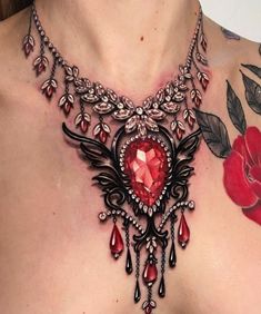 a close up of a woman's chest with tattoos and jewelry on her chest