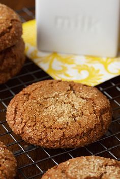 cookies cooling on a wire rack next to a yellow napkin