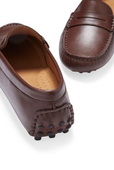 Hugs & Co. brown leather penny loafer driving shoes for women. Moccasin style driving loafers in luxurious brown outer and lined with a soft leather for extra comfort. Made in Portugal MATERIAL 100% leather upper featuring a 100% leather Liningrubber studded sole