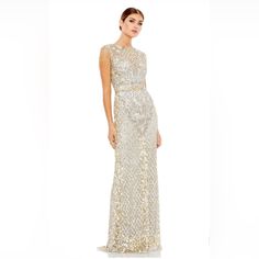 Full Length Gown With Sequins, Jeweled Tasseled Sleeves, And Faux Belt. Mac Duggal Hand-Embellished Mesh Overlay; 100% Polyester Lining Partially Lined Bodice; Fully Lined Skirt; Semi-Sheer Unlined Sleeves Illusion High Neckline Beaded Fringe Cap Sleeves All-Over Intricate Floral And Baroque Detailing Sequined Lattice Pattern Featured On Skirt And Neckline Paillette Sequined Waist Detail Sweeping Train Concealed Back Zipper Approx. 62.5" From Top Of Shoulder To Bottom Hem Available In Platinum G Elegant Sleeveless Maxi Dress For Reception, Champagne Embellished Sleeveless Gown, Champagne Sleeveless Sequin Gown, Sleeveless Sequin Evening Dress For Reception, Embellished Sleeveless Evening Dress For Reception, Elegant Sleeveless Evening Dress For Reception, Gold Sleeveless Reception Dress, Elegant Sleeveless Reception Dress, Mac Duggal Dress