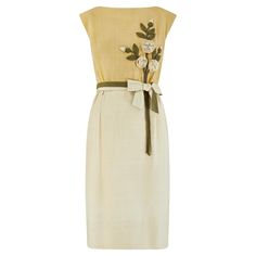 Designed by Jane Frye, this pretty sleeveless dress is almost certainly an early 1960s piece. It is crafted from soft, lightly textured silk or a silk blend in three complementary hues of green and adorned with sculptural appliqué of roses, buds, leaves and vines. A two-toned belt encircles the waist and is clipped onto a large bow at the front with an adjustable hook-and-eye clasp. The skirt is softly pleated at the waist and falls to the mid-calf. The whole dress is lined with pale chartreuse silk. A very high quality and wearable piece; the original label reads "Jane Frye - Minocqua” - an area of Wisconsin, USA. I absolutely love design and like to think that it was inspired by the Christian Dior dress that Elizabeth Taylor wore to the 1961 Oscars where she won for her performance as a Sleeveless Silk Midi Dress For Garden Party, Beige Sleeveless Dress For Cocktail In Spring, Beige Sleeveless Dress For Spring Cocktail, Sleeveless Summer Cocktail Vintage Dress, Cream Silk Sleeveless Midi Dress, Elegant Sleeveless Beige Vintage Dress, Spring Silk Sleeveless Knee-length Dress, Elegant Summer Silk Vintage Dress, Elegant Silk Vintage Dress For Summer