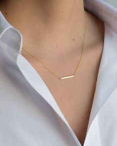 "14K solid gold Bar necklace with a tiny diamond , comes in the gold color of your choice, and length of your choice, dainty and absolutely amazing! The perfect everyday necklace, by itself or layered. made in L.A. Size: Approx. 1\" Diamond: 0.01 ct wt Ships in 5 to 7 business days Comes gift ready in our beautiful branded jewelry box." Simple Name Necklace With Delicate Chain, Minimalist Name Necklace With Delicate Chain, Minimalist Engraved Rectangular Bar Necklace, Minimalist Nameplate Necklace, Gold Bar Necklace With Nameplate For Everyday, Gold Rectangular Minimalist Name Necklace, Classic Everyday 14k Gold Bar Necklace, Dainty 14k Gold Bar Necklace Gift, Minimalist Delicate Chain Bar Necklace For Anniversary