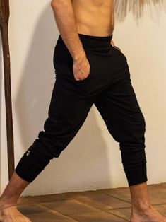 Black Stretch Cotton Jogger Style Drop Pants.  - Handmade -Unisex -Stretch  -Flowing relaxed fit - Slight drop crotch, great for sizes S, SM and M -Inner drawstring to secure the waist -2 side pockets We are so stoked to introduce new glorka pants design with just a slight drop. Great as a casual wear, not as baggy as the original glorkas - these pants are easy to wear and quite practical.  STYLING TIP: Pull the bottoms up to the knees, lower the waist and style them with the boots - they will look amazing! Wear it for Yoga, Dance, Exercises, Meditations, Yoga Practice, festivals, desert adventures and beyond... Materials: black color cotton blend (95% cotton 5% lycra).  Fabric for this pair were bought in Fashion District, LA and the pant was made in one of our studios in New York. Measur Summer Looks For Men, Dance Exercises, Yoga Dance, Fashion District, Lycra Fabric, Fashion Joggers, Asymmetrical Tops, Pants Design, Off White Color