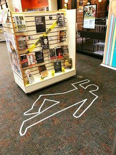 there is a book display in the middle of the floor with some books on it