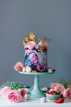 there is a cake with flowers on the table