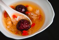 two spoons in a bowl filled with food