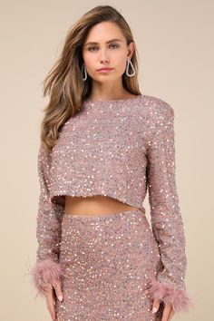 If there's a spotlight nearby, it'll be easy for you to steal it in the Lulus Sparkling Behavior Mauve Pink Sequin Feather Long Sleeve Top! Sparkling sequins and shiny tinsel-like details cover this mesh knit top with a classic crew neckline framed by long sleeves with fun, feather-trimmed cuffs. The boxy bodice falls to a flirty cropped hem, while a keyhole detail at back secures with a top button closure. Pair with the matching skirt for a complete look! Fit: This garment fits true to size. Le Mauve Pink, Pink Sequin, Long Sleeve Top, Crew Neckline, Knit Top, Bodice, Sequin, Long Sleeve Tops, Sleeve Top