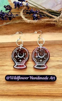 Beautiful sparkly dangle earrings. Lovely crystal ball design. Lots of colours to choose from. See the rest of my shop for more items. https://linktr.ee/Wildflowerrhandmadeart Crystal Ball Earrings, Resin Jewellery, Ball Design, Ball Earrings, Fortune Teller, Blue Sparkles, Skull Earrings, Blue Glitter, Handmade Jewellery