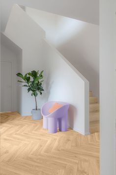 A modern bright hallway featuring a wood-effect cushion vinyl floor with a herringbone pattern. Lvt Flooring