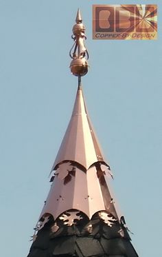 the top of a building with a clock on it