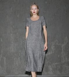 A cool linen dress is an absolute must-have in any woman's wardrobe. The loose-fitting style of this gray dress will give you not only comfort but also a fabulous silhouette no matter what size you are. Whether you decide to wear this dress for lounging around the house or at the office, you'll know that you'll be able to keep cool. Anyone who has experienced the coolness of wearing cool linen fabric would never want to not own linen clothing. This is especially true when it comes to women's dre Gray Shift Dresses For Summer, Gray Fitted Short Sleeve Maxi Dress, Gray Short Sleeve Midi Dress For Summer, Gray Knee-length Midi Dress For Summer, Gray Knee-length Summer Midi Dress, Gray Midi-length Summer Dresses, Fitted Gray Casual Dress, Spring Gray Shift Dress, Elegant Mid-length Dress With Relaxed Fit