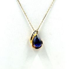 "Darling 14K yellow gold pendant with a blue sapphire and diamonds.  Marked 14K.  20 inch adjustable length 10K yellow gold chain included!  Marked 10K.  A wonderful gift or addition to your personal jewelry collection. FREE SHIPPING! Details:  14K and 10K Yellow Gold: (as shown in picture) Sapphire: (10) 9.5 mm x 6.3 mm pear Gem Color: Blue Diamond: (3) 1.5 mm round Approximate Total Diamond Weight: .05 carats Diamond Clarity: SI Diamond Color: H Approximate Pendant/Brooch Dimensions: 5/8 inch x 3/8 inch Chain Length: 20 inches (adjustable) Total Weight (together): 2.6 grams FREE domestic shipping by USPS Priority Mail delivery confirmation and includes insurance. If the item is to be shipped internationally Etsy will calculate postage. Please notify us at purchase if you are buying more Blue 14k Gold Necklace For Anniversary, Blue 14k Gold Necklaces For Anniversary, Blue Diamond Jewelry Stamped 14k, Blue Teardrop Pendant Necklace With 17 Jewels, Blue Teardrop 14k Gold Necklace, Gold Teardrop Sapphire Necklace, Pear-shaped Sapphire Necklace Gift, Blue Pear-shaped Sapphire Necklace, Elegant Sapphire Square Pendant Jewelry