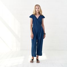 "Stunning, elegant linen jumpsuit with deep V neckline is a something impressive and practical, suitable for your everyday life. This piece of clothing is very feminine, very comfortable and absolutely beautiful. Blue summer overalls will surely make your day: wide pants, two side pockets and elegant tie belt, all is needed is put it on and smile. FABRIC: 100% Highest quality, stonewashed linen MODEL: Our model (5'7\") is wearing size S(36) COLOR: This is Royal blue colored blouse. However, I ca Cotton Denim V-neck Jumpsuit, Blue V-neck Relaxed Fit Jumpsuit, Blue V-neck Relaxed Fit Jumpsuits And Rompers, Spring Linen V-neck Jumpsuit, Linen V-neck Jumpsuits And Rompers For Spring, Spring Linen Jumpsuit With V-neck, Cotton V-neck Jumpsuit For Work, Relaxed Fit Linen Jumpsuit With V-neck, Patterned Bridesmaid