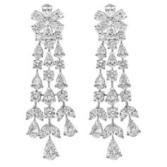 A fashionable and spectacular chandelier earrings showcasing three rows of mixed cut diamonds, set in a elegant waterfall floral-motif design weighing 12.45 carats total. Omega Clip with post and Finely Made in 18k white gold. Style available in different price ranges. Prices are based on your selection. Please contact us for more information. Modern Diamond Jewelry, White Gold Drop Earrings, Real Diamond Earrings, Diamond Chandelier Earrings, Diamond Chandelier, Earrings Chandelier, Diamond Rings Design, Jewelry Showcases, Expensive Jewelry