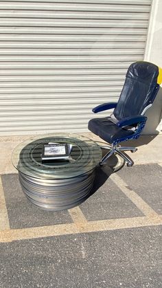 a chair sitting on top of a metal table