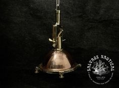 an antique brass lamp is on display against a black background with the words salvage nautitchery written below it