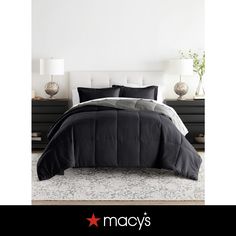 a black and white comforter set on a bed