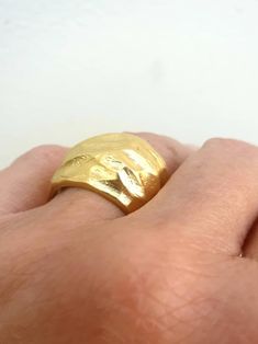 This is a beutifull 14 k gold plated brass, big noticeable ring. A rustic textured statement ring . it is a designer statement ring. A great gift for loved ones or for yourself. This stunning big 14 karat gold plated brass ring, is a very impressive piece. Its a chunky ring that makes a fashionable statement. The ring will look great with both casual & elegant wear. HANDMADE ITEM Materials: This ring is made of 14 karat gold plated brass. You can also choose between Sterling silver black oxi Elegant Wide Band Brass Ring, Elegant Handmade Thick Band Wide Ring, Elegant Handmade Wide Band Ring, Elegant Handmade Wide Band Yellow Gold Ring, Elegant Handmade Yellow Gold Wide Band Ring, Elegant Handmade Wide Band Ring In Yellow Gold, Unique Gold Dome Promise Ring, Gold Wide Band Rings, Gold Chunky Ring