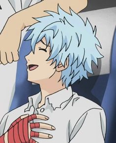 an anime character with blue hair holding his hand up to his face and looking at the camera