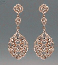 two pairs of earrings with diamonds on them