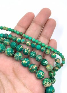 Imperial Sediment Green Bead Top quality semi-precious stones beads at great price. Nice and smooth round beads shaped. Size : 10mm Hole Size: 0.8 mm Color: Green Bead You will receive One strand of 10mm beads. Strand: 15.5 Inch strand of 38 beads. Also available in: 4mm 15.5 Inch Strand approximately 92 Beads6mm 15.5 Inch Strand approximately 65 Beads8mm 15.5 Inch Strand approximately 48 Beads Sediment Bead Meaning Sediment Jasper Bead is a gemstone of stability. ... The blue & green varieties Matte Pictures, Bead Top, Beaded Top, Heishi Beads, Picture Jasper, Jasper Beads, Jade Beads, Semi Precious Stones, Mala Beads