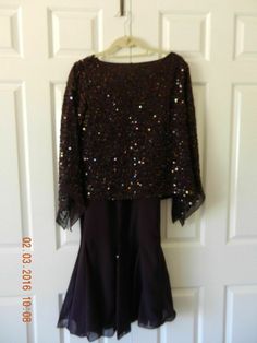 Midnight Velvet Catalog Design Burgundy/Maroon/Deep Plum  Mermaid Tulip Skirt Suit with Sequin Top  Size M  (8-10) ~ ~ NWT  ~ ~  Great skirt suit from Midnight Velvet.  It has a dark burgundy top with glitter accents and sheer sleeves that have a diagonal cut.  The skirt comes to a flare at the bottom with glitter in the panels.  Some call the style a Mermaid Skirt or a Tulip Skirt.  Beautiful seaming down the front & back of the skirt to accentua Purple Sets For Fall Party, Fitted Burgundy Party Sets, Design Bag, Tulip Skirt, Burgundy Top, Dark Burgundy, Deep Plum, Catalog Design, Mermaid Skirt