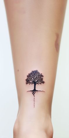 An exquisite minimalistic tree ankle tattoo, symbolizing resilience and a strong bond with nature. Perfect for anyone desiring a unique, aesthetic ankle tattoo. Small Nature Tattoo, Resilience Tattoo, Ankle Tattoo Men, Pine Tattoo, Aesthetic Tree, Planting A Tree, Ankle Tattoo Designs