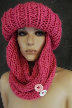 Hand knit toboggan and Infinity scarf Color: Bubble Gum pink Size: one size fits most Materials: acrylic yarn/buttons Care: machine wash, cool water/ fluff dry My most popular winter hat/scarf set , this time in bubble gum pink, is knit in an acrylic yarn providing both warmth and comfort. The infinity scarf, finished with two large buttons ( one light pink, the other white), can be worn several ways as shown in the photos.  One of the warmest ways is to lay the scarf on top of your head, loop t Silly Hats, Knit Ideas, Ski Hat, Crochet Hat Free, Hats Women, Crochet Bralette, Knit Poncho, Crochet Hats Free Pattern, Bubble Gum Pink