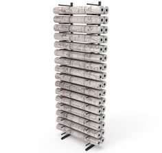 a large stack of rolled up newspaper on top of each other in front of a white background