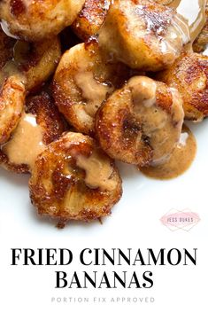 fried cinnamon bananas on a white plate covered in syrup