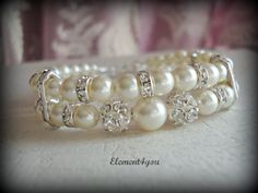 Bridal cuff bracelet Swarovski white or ivory by Element4you, $35.00 Adjustable Pearl Embellished Bracelet For Wedding, White Pearl Embellished Bracelets For Wedding, Adjustable Pearl Wedding Bracelet, Wedding Pearl White Beaded Bracelets, Delicate Beaded Bracelets For Wedding, Delicate Pearl Drop Beaded Bracelets For Wedding, Delicate Beaded Bracelets With Pearl Drop For Wedding, Pearl White Beaded Bracelet For Wedding, Wedding Pearl Bracelet With Beaded Details