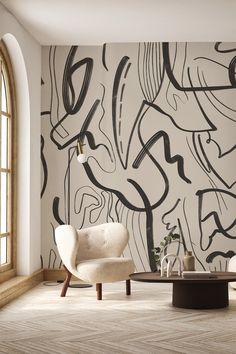 a living room with an abstract wallpaper design