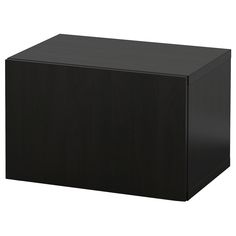 a black box sitting on top of a white surface