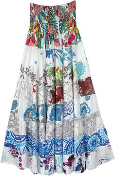 A serene white classy skirt with mixed floral and ethnic prints with a soft smocking waist.  This is a two-in-one skirt and a dress. #tlb #TieredSkirt #vacationclothing #beachwrap #Floral #Printed #Tieredskirt #Smockedskirt #Rayonskirt #Skirtdress White Floral Print Tiered Skirt, Spring Floral Patchwork Maxi Skirt, White Flowy Maxi Skirt With Floral Print, Bohemian White Maxi Skirt With Gathered Detail, Bohemian White Gathered Maxi Skirt, White Bohemian Dress With Gathered Skirt, White Flowy Floral Print Maxi Skirt, White Bohemian Tiered Skirt, Bohemian White Tiered Skirt