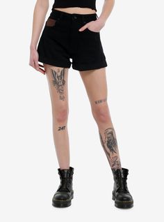 Bring the grungy witch look into summer in these black  high-rise mom shorts! Featuring brown contrast back pockets with skull sun and moon designs.Please note: Style is fitted with no stretch; size up for a looser fit.100% cottonWash cold; dry flatRise: 11''Inseam: 3''ImportedListed in junior sizesModel is 5'9''Model wears size 3 Black Grunge Shorts For Alternative Fashion, Black Grunge Shorts For Grunge Fashion, Edgy Festival Shorts, Alternative Fashion Style Short Bottoms, Alternative Black Streetwear Shorts, Alternative Black Shorts For Streetwear, Gothic Summer Shorts For Streetwear, Punk Style Shorts For Festivals, Alternative Style Cotton Shorts For Alternative Fashion