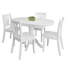 a white table with four chairs and two vases on top of it, against a white background